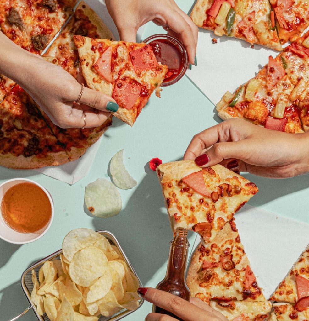 Friends Having a Pizza Party at Rusted Sun Pizzeria SLC Image by Aris Leoven from capturenow