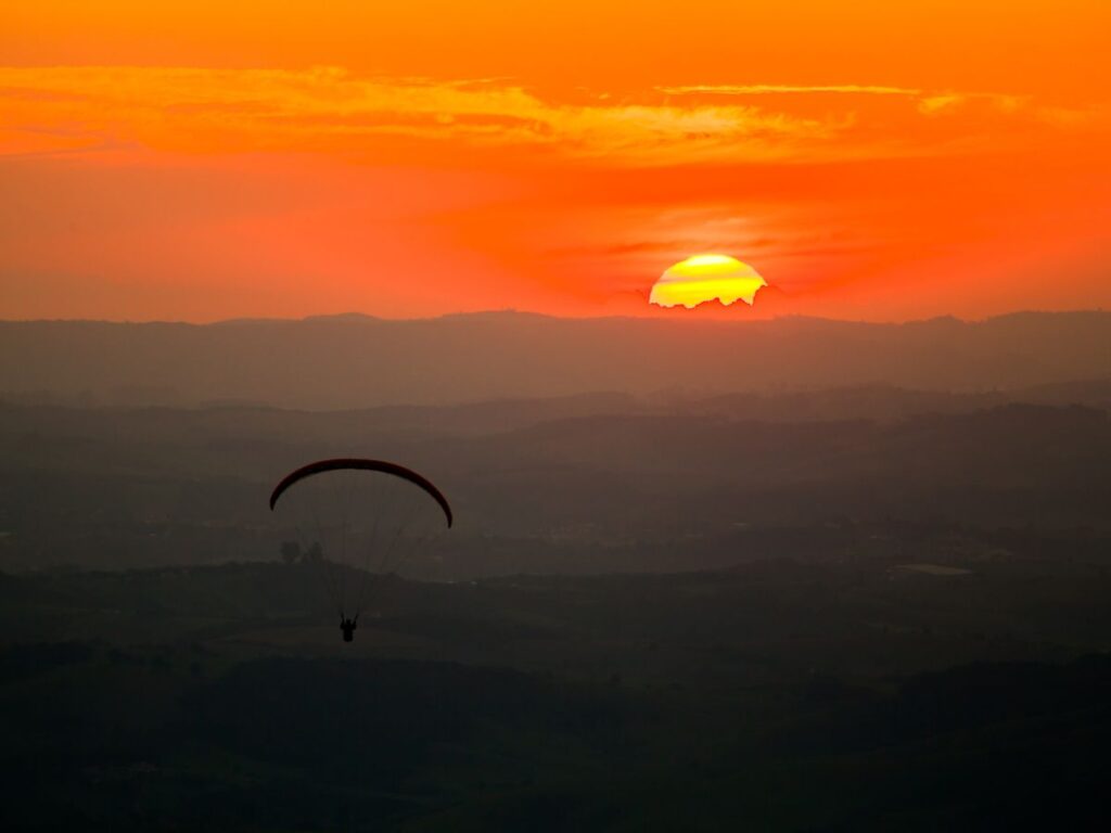 Paragliding in sunset Image by TacioPhilip from Getty Images