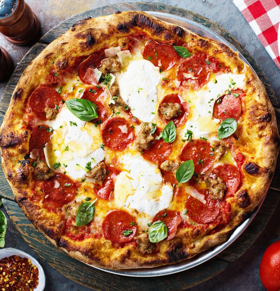 Traditional Pepperoni pizza at Sicilia Pizza & Kitchen image by VeselovaElena from Getty Images Pro