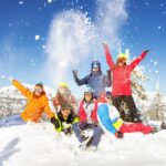 Happy skiers Things to Do in Salt Lake City in Winter phone by molchanovdmitry from Getty Images Pro