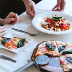 Woman at one of the Italian Restaurants Photo by Antonius Ferret from Pexels